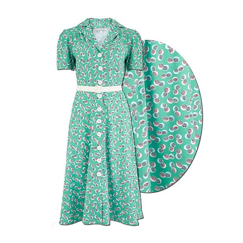 Klassisk 1950 stil skjortekjole med behagelig pasform og et smukt farverigt prikket polkaprik print på en grøn bund