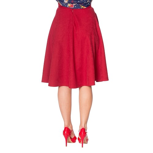 Charmerende og super klassisk retro-inspireret 50’er nederdel med vidde i flot rødt fløjs lignende stof og med praktiske lommer i sidesømmen